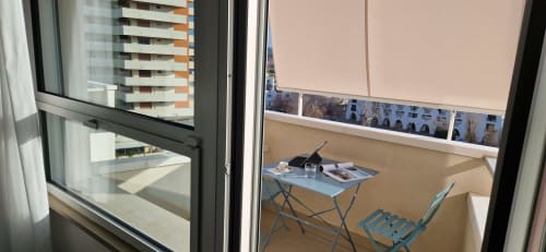 Balcony workspace at Lamar Suites Seafront Apartments in Misano Adriatico with sea view, small table, chair, and coastal