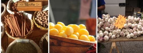 Exhibición de mercado en Ajoucadou B&B en Lourmarin con vainas de vainilla, cítricos y bulbos de ajo