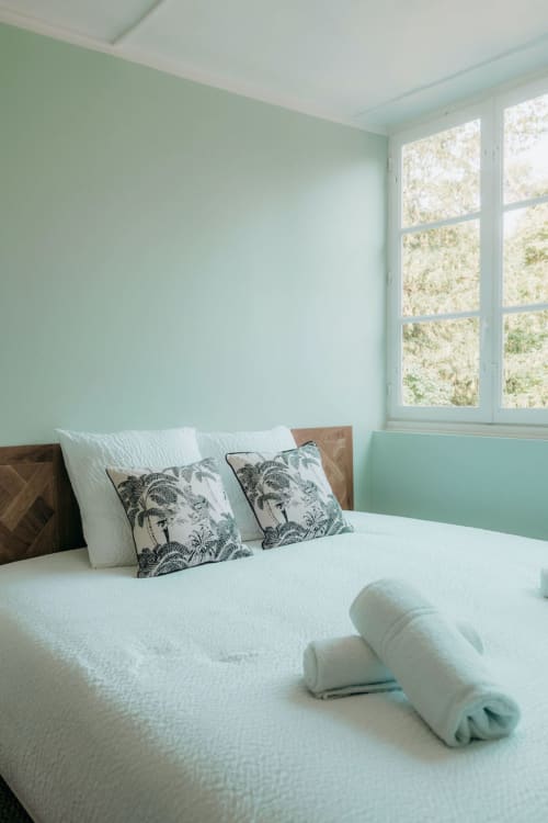 Bedroom with jungle cushions