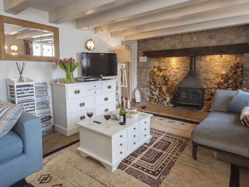 Log burner feature fireplace Dittisham Riverside cottage family friendly accommodation nautical themed cottage group stays holiday let