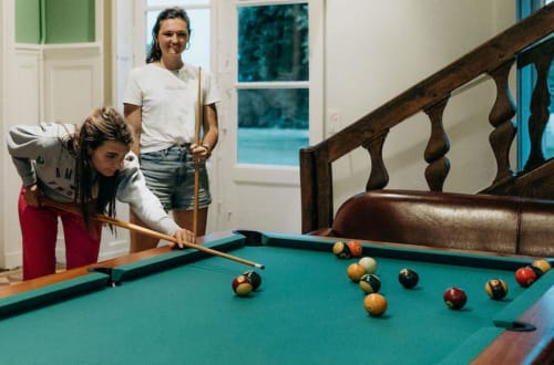 Playing pool in an airbnb