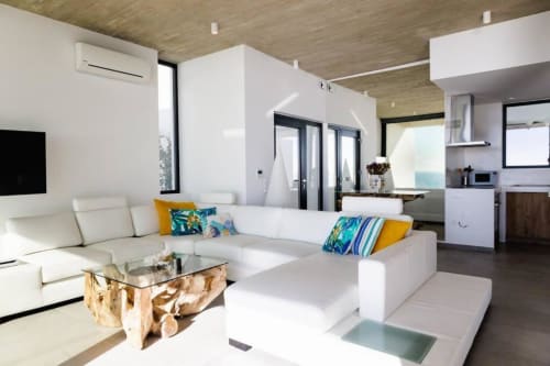 Spacious living room of the villa in Tinos with panoramic views of the Aegean Sea and the Cyclades