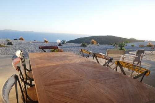 outdoor dining room with views of the Aegean Sea and the Cyclades from the villa for rent in Greece