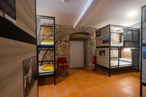 Bunk bed room in a mixed dormitory with air conditioning and Shared bathroom with shower. Tiled floor. Max occupancy: 1 person. Caminho Português da Costa - Camino de Santiago. Coastal way Senda Litoral