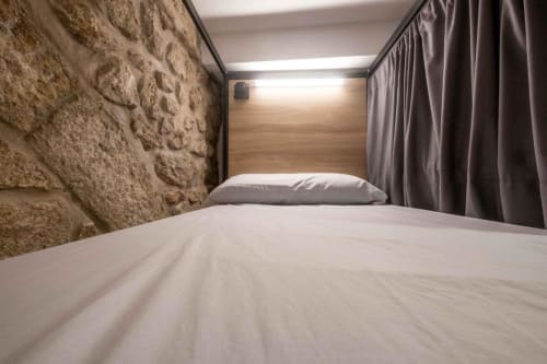 bunk beds in mixed dormitory at Albergue Santiago de Caminha hostel in Caminha, Portugal -Room in a mixed dormitory with air conditioning and Shared bathroom with shower. Tiled floor. Max occupancy: 1 person. Caminho Português da Costa - Camino de Santiago. Coastal way Senda Litoral