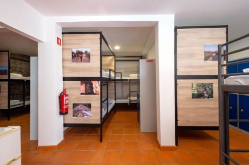 bunk beds in mixed dormitory at Albergue Santiago de Caminha hostel in Caminha, Portugal -Room in a mixed dormitory with air conditioning and Shared bathroom with shower. Tiled floor. Max occupancy: 1 person. Caminho Português da Costa - Camino de Santiago. Coastal way Senda Litoral