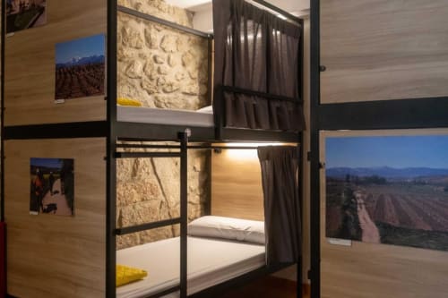 bunk beds in mixed dormitory at Albergue Santiago de Caminha hostel in Caminha, Portugal -Room in a mixed dormitory with air conditioning and Shared bathroom with shower. Tiled floor. Max occupancy: 1 person. Caminho Português da Costa - Camino de Santiago. Coastal way Senda Litoral