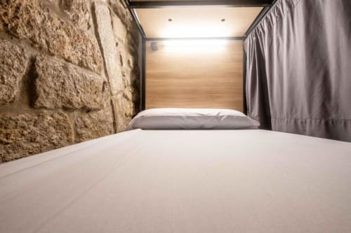 bunk beds in mixed dormitory at Albergue Santiago de Caminha hostel in Caminha, Portugal -Room in a mixed dormitory with air conditioning and Shared bathroom with shower. Tiled floor. Max occupancy: 1 person. Caminho Português da Costa - Camino de Santiago. Coastal way Senda Litoral
