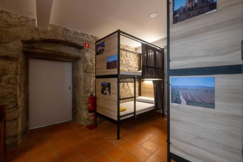 bunk beds in mixed dormitory at Albergue Santiago de Caminha hostel in Caminha, Portugal -Room in a mixed dormitory with air conditioning and Shared bathroom with shower. Tiled floor. Max occupancy: 1 person. Caminho Português da Costa - Camino de Santiago. Coastal way Senda Litoral