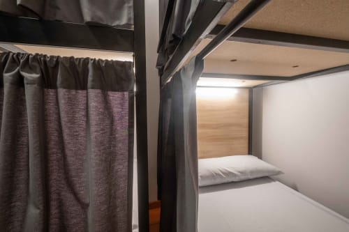 bunk beds in mixed dormitory at Albergue Santiago de Caminha hostel in Caminha, Portugal -Room in a mixed dormitory with air conditioning and Shared bathroom with shower. Tiled floor. Max occupancy: 1 person. Caminho Português da Costa - Camino de Santiago. Coastal way Senda Litoral