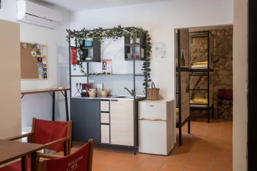 bunk beds in mixed dormitory at Albergue Santiago de Caminha hostel in Caminha, Portugal -Room in a mixed dormitory with air conditioning and Shared bathroom with shower. Tiled floor. Max occupancy: 1 person. Caminho Português da Costa - Camino de Santiago. Coastal way Senda Litoral