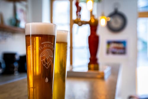Craft beers with branded glass at La Maison George bar in Flavigny sur Ozerain, France