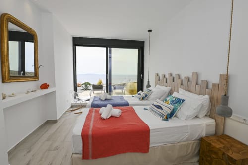 view of one of the bedrooms of dream cave villa for rent on Tinos: open sea view, dream, luxury and serenity