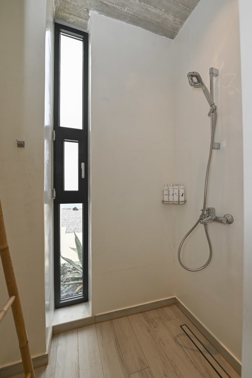 Luxury of a rain shower facing the Aegean Sea from each of the rooms of dream cave villa.