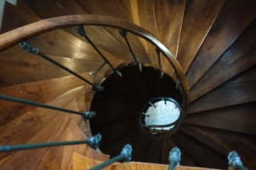 Spiral staircase view from above at Le Fassardy bed and breakfast in Châteauroux, France