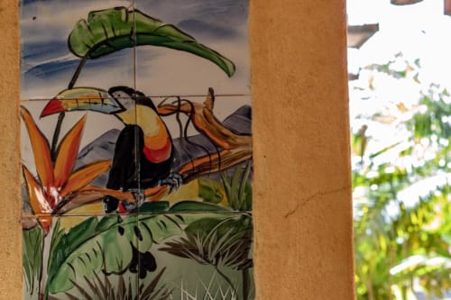 Colorful toucan tile mural with tropical flowers at Villa Mango B&B Tucan room in Nosara