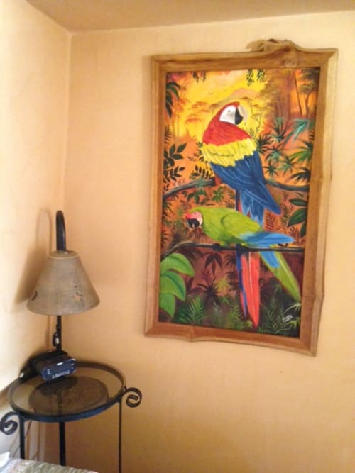 Colorful parrot artwork in wooden frame at Villa Mango B&B Nosara, Costa Rica garden view room