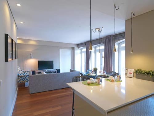 Modern Superior Apartment at New Oporto with open kitchen, dining area, living room, and city views from balcony