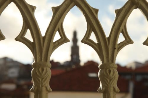 Ornate white balcony railings frame Porto city skyline view from New Oporto Apartments Superior Apartment