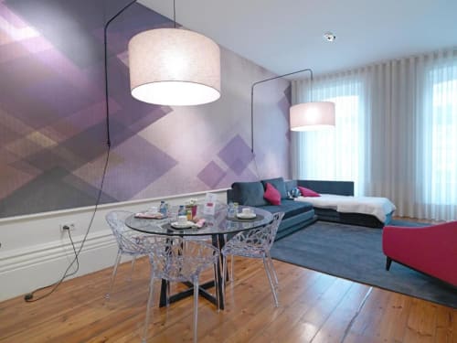 Deluxe apartment at New Oporto with dining table, pendant lighting, modern sofa, and city views in Porto