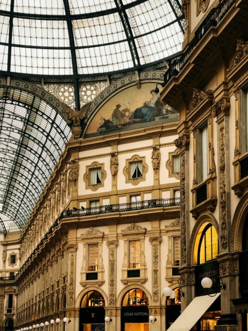 Galleria Vittorio Emanuele II in Milano with ornate architecture and glass roof, luxury shopping destination