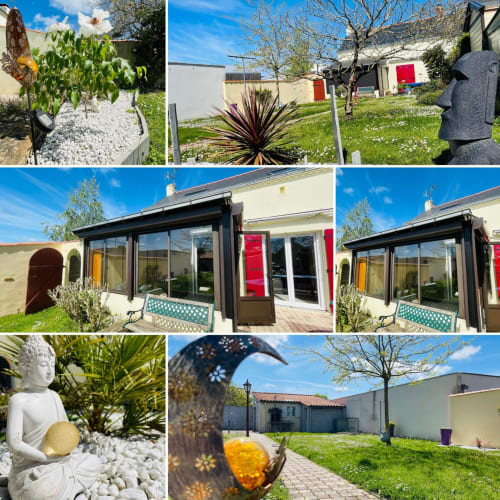 Jardin de la chaumière Darazac avec patio moderne, sculptures décoratives, aménagement paysager luxuriant et espaces extérieurs sereins