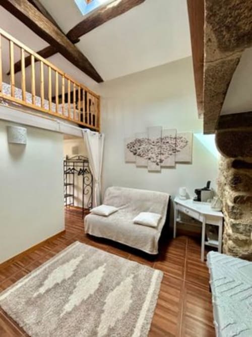 Chambre la Chouanne at Logis De La Bénétière in Treize-Vents: bright room with beamed ceiling, mezzanine, wooden