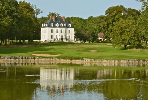Le Prieuré Du Preux B&B in Sépeaux, France: elegant white mansion with mansard roof reflected in pond