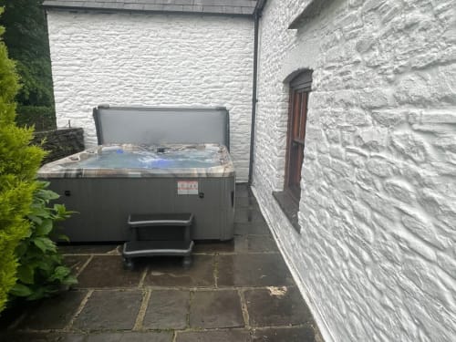 Outdoor Hot Tub guest relaxation Large farmhouse for group stays in Wales