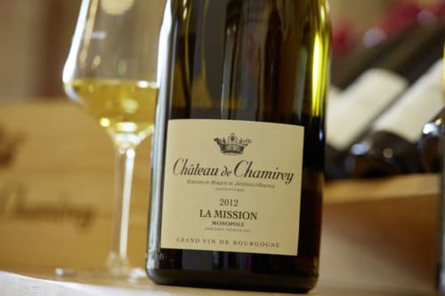 Château de Chamirey La Mission 2012 Burgundy wine bottle with glass at Les Maisons de Chamirey, Mercurey