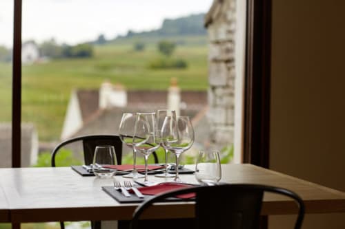 Elegant dining setup at Les Maisons de Chamirey with vineyard views in Mercurey, France