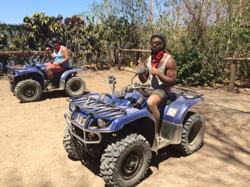 Guests on blue ATVs at Villa Mango B&B adventure tour in Nosara, Costa Rica