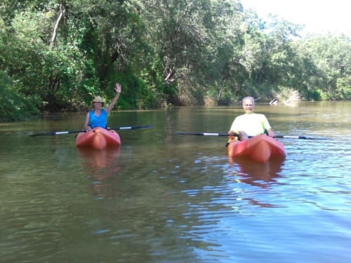 Two guests kayaking on river near Villa Mango B&B in Nosara, Costa Rica