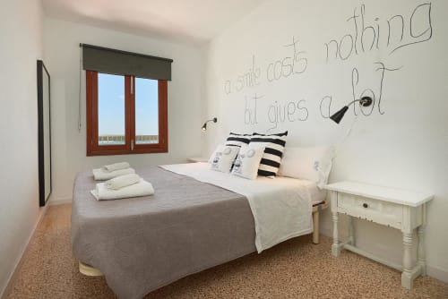 Modern bedroom with sea view window at Enjoy the Sea hotel in Colonia de Sant Jordi, Spain