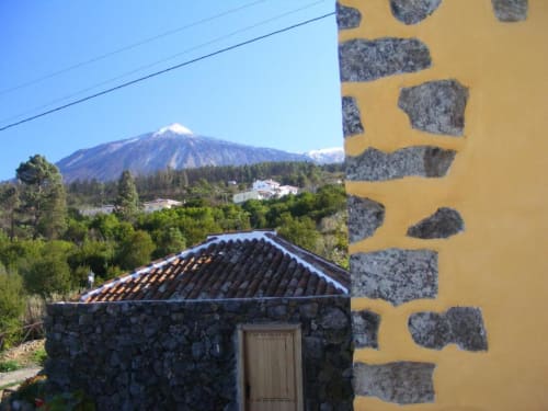 Teide volcano view from Casonas de Marengo cottage in Icod de los Vinos, Canary Islands with stone architecture