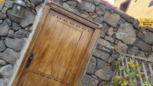 Rustic wooden door with iron details in a stone cottage at Casonas de Marengo, Icod de los Vinos