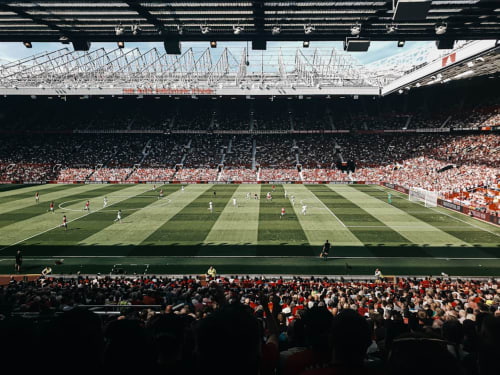 Old Trafford stadium packed with fans during match, Manchester football venue