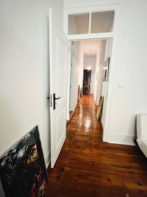 Hallway with wooden floors and white doors at Royal Prince Garden Apartments in Lisboa