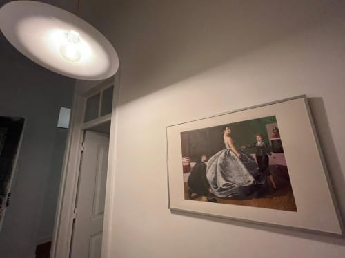 Hallway at Royal Prince Garden Apartments Lisboa with framed classical artwork and modern lighting