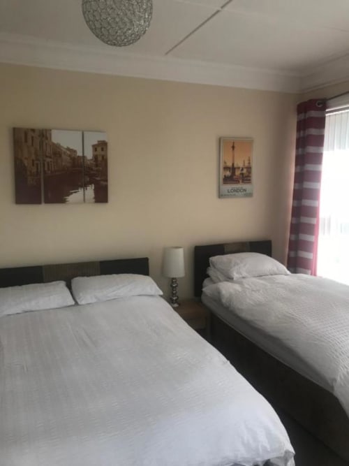 Triple room at The Ball Alley B&B in Stanley, County Durham, with two beds and modern amenities
