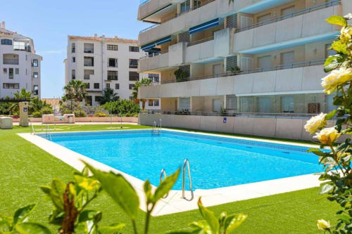 Luxury apartment with swimming pool and green lawn in Marbella, Puerto Banús, Spain