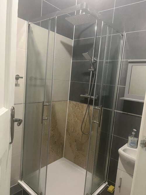 Modern glass-enclosed shower with rainfall showerhead in Silver Ensuite Room at Starlet Property hotel, London