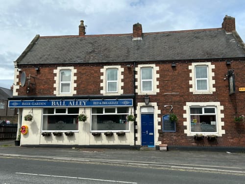 Ball Alley pub and bed & breakfast in Stanley, County Durham, red brick building with white window frames