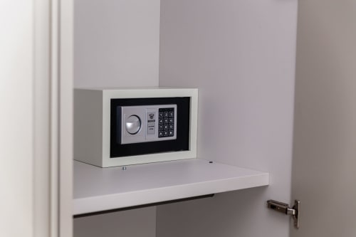 Digital safe with keypad and dial lock mounted in wall at Altavilla Boutique Holidays House, Marsala