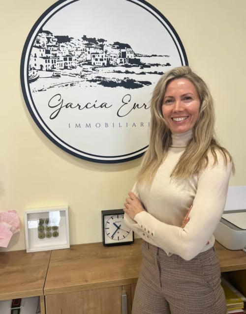 Property manager smiling at Garcia Enrich Immobiliaria office in Palafrugell, Spain