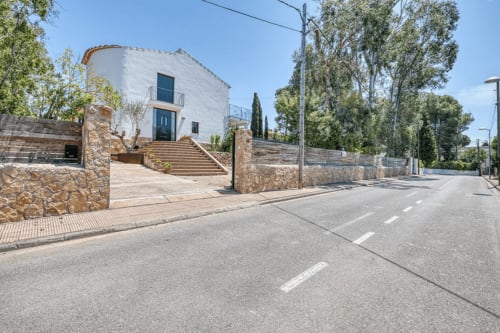 Modern whitewashed cottage with stone accents and private pool near beach in Palafrugell, Spain