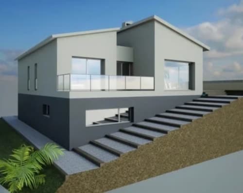 Modern two-story house with white upper level, gray lower level, and exterior stairs in Palafrugell, Spain