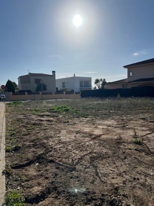 Vacant land plot at Finques Garcia Enrich property in Palafrugell, Spain with modern houses nearby