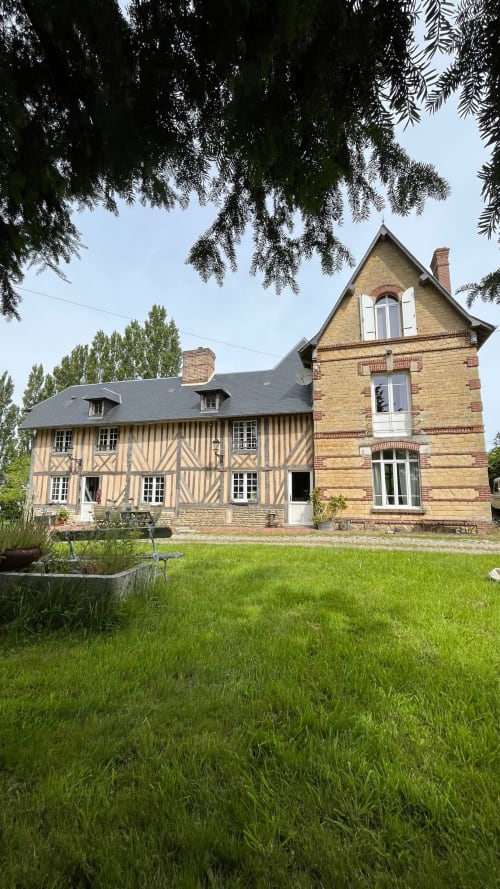 Domaine de Blanvatel BnB in Saint Pierre en Auge featuring half-timbered and brick manor house with manicured lawn