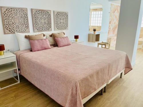 Bright Family Suite bedroom with pink bedding, carved wood panels, modern furnishings and sea view in Arguineguín
